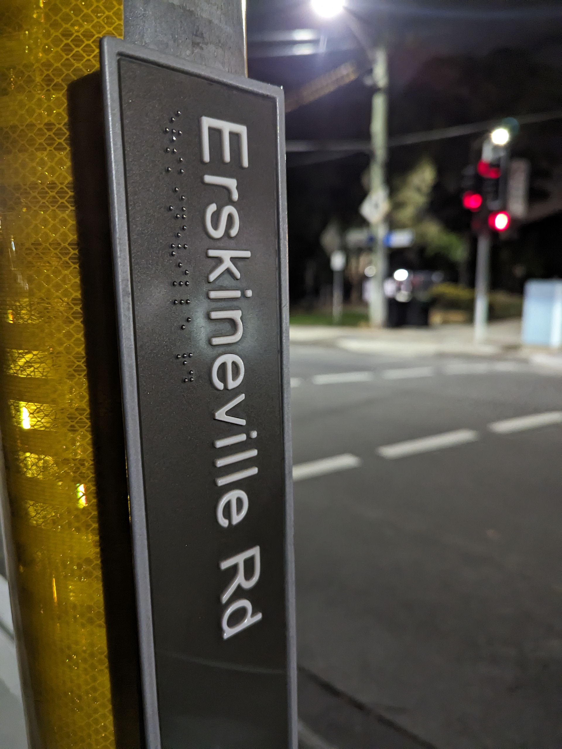 street name on traffic light pole, about 5 feet from ground level